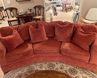 Rose upholstered curved couch… sooo comfortable!