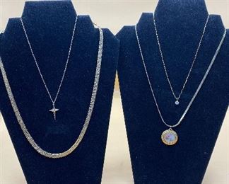 Four Gold Colored Necklaces Three with Pendants