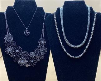 Four Silver Toned Necklaces