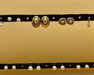 Nine Pairs of Pearl Colored Earrings