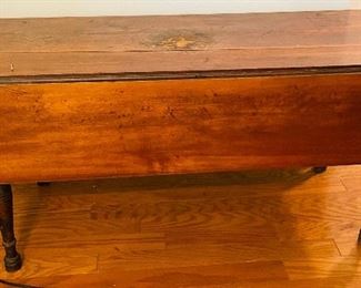 $195 
Antique primitive coffee table 48Lx19W + 2 leaves 10 1/2"
Damage at center / crack on center plank 
