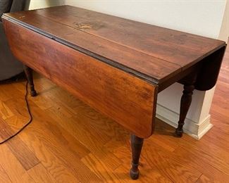 $195 
Antique primitive coffee table 48Lx19W + 2 leaves 10 1/2"
Damage at center / crack on center plank 