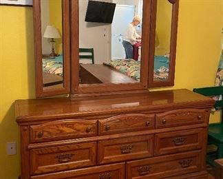 $350 
Solid Oak dresser with 8 drawers triple mirror
64Lx18Dx72"