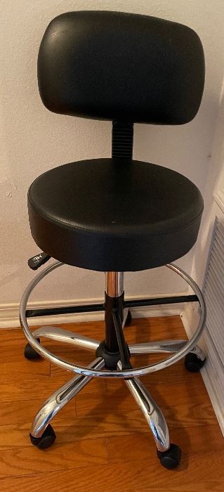 $70 
Tall swivel chair on caster, faux leather round seat 