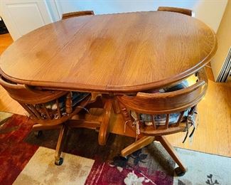 $395 
Solid Oak table with 4 barrel chairs 42"Dx30T +1 leave 18”