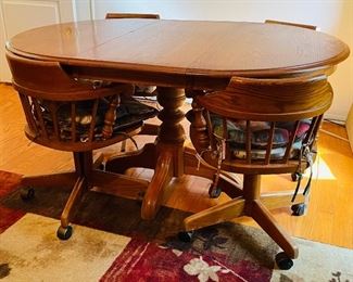 $395 
Solid Oak table with 4 barrel chairs 42"Dx30T +1 leave 18”