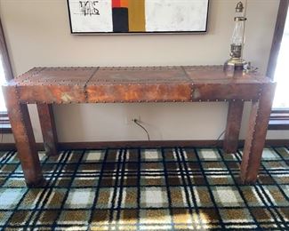 Custom riveted brass console table