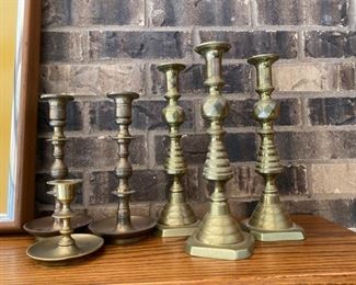 collection of brass candlesticks