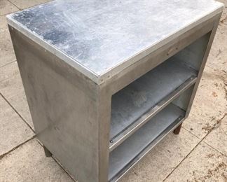 Stainless steel cabinet shelf.