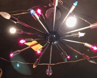 Dark metal lamp with colored bulbs.