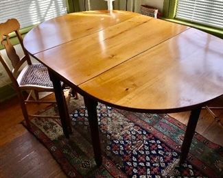 Wooden Dining Table that is Believed to be made from a Single Tree with 4 Cane Seat Maple Dining Chairs 