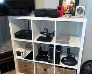 nine cubes storage with three baskets and tons of gaming equipment