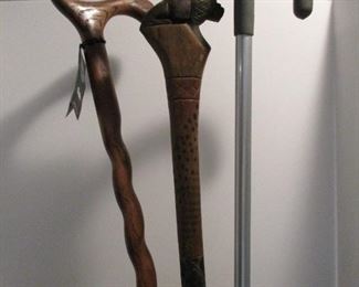 THREE CANES/WALKING STICKS -                                            1 ADJUSTABLE METAL    $5                                                              
                                                                                                                        
      2 W00DEN CARVED (SEE NEXT 2 PICTURES  )
