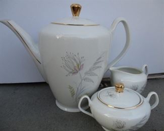 BEAUTIFUL BAVARIAN TEAPOT, CREAMER AND SUGAR WITH A DELICATE FLORAL PATTERN.    $24