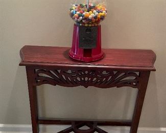 vintage gumball machine, carved small console table