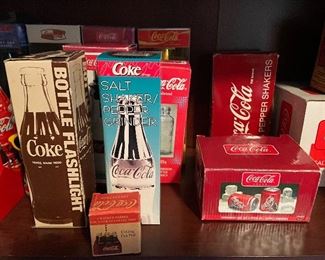 tons of Coca Cola items!! Salt and pepper sets, flashlight,