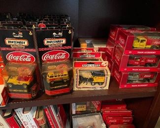 tons of Coca Cola cars and trucks