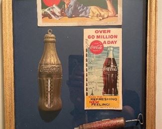 display of old advertising items framed