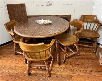 Formica topped wooden table with 3 leaves and 4 chairs