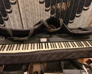 QS8 key board with stool, case, stand, speakers, amp, mixer. 