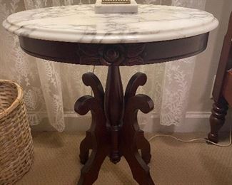 One of 2 marble top end tables