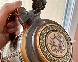 detail on one of the Mettlach Steins