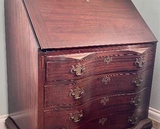 Modern mahogany fall-front desk, serpentine front, ball and claw feet, functional and decorative