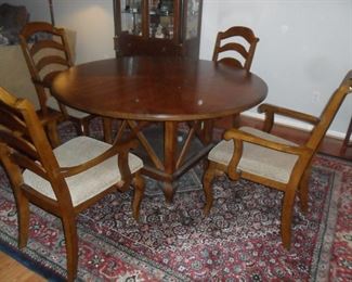 Round dining room table with 4 chairs by Standard Furniture