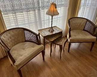 Pair of upholstered barrel chairs with caning