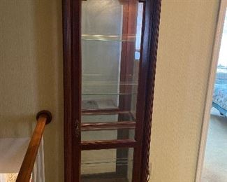 Curio Cabinet
Tall wood curio cabinet with glass shelves, mirrored back and built in light
