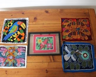 Five Mola Folk Art Appliqued Textiles, largest 13 1/2” by 16 1/2”, framed one overall 12” by 16”, Mola 9” by 11”.