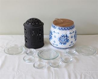 Group of Candle holders, etc., six glass tea light holders, 3” diameter, three glass pillar candle holders, 5 1/2” diameter, one metal lantern style, 8 1/2” tall by 6 1/2” diameter, and one blue and white Opal House jar 7 1/2” tall.
