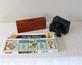 Group of three items, Monopoly, Chicago Edition, and Bushnell Citation Binoculars, and a monogrammed leather case for a liqueur set, case measures 13 1/4” long, 5 1/2” high, and 3 1/2” deep.