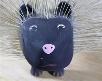 Large Carved Wood Sculpture of Porcupine, Overall length 32”, body length 27 1/2”, overall height 20 1/2”, overall depth 15 1/2”.