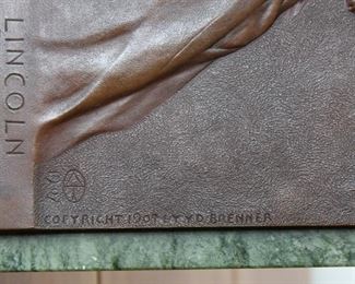 V. D. Brenner's classic Abraham Lincoln Bronze plaque on green marble.  Lower right has "Copyright 1907 by V. D. Brenner". To the left of that is the arrow/oval logo with 1907, The bottom of the plaque reads ABRAHAM LINCOLN **1809 * 1865 **.  Affixed to green marble with a bronze fully functioning easel marked S. KLABER & CO. / FOUNDERS N. Y.  One of the most familiar pieces of art in U.S history with billions circulating every day in the form of the Lincoln Cent.  This is probably from the first set of castings, being marked on the reverse with the Foundry name.