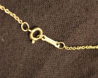 Elsa Peretti 18K Yellow Gold Eternal Circle Pendant on a Tiffany & Co. 28" gold chain.
