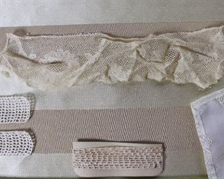 Another group lot that includes a variety of lovely antique lace trims and an antique V shaped collar