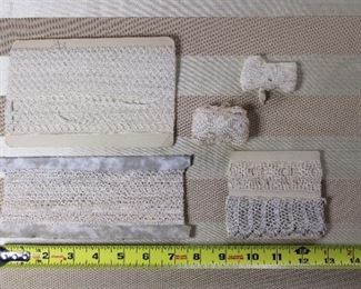 A group of antique lace trim wrapped on cards