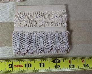 A group of antique lace trim wrapped on cards