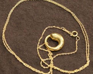 Tiffany & Co. 18K yellow gold chain and pendant designed by Italian Jewelry Designer Elsa Peretti