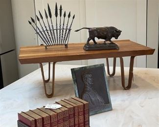 Edward Wormley for Dunbar 36" Long John Table or Bench, antique bronze figure of a bull, V D Brenner bronze of Abraham Lincoln, antique books, beaded African darts