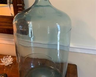 #48	Blue Tinted Glass Jug - 19" Tall 	 $35.00 			
