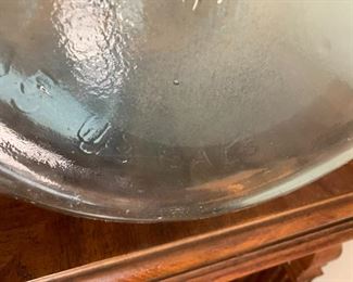 #48	Blue Tinted Glass Jug - 19" Tall 	 $35.00 			
