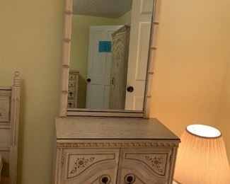 #98	Bassett Dresser w/2 doors, 1 shelf w/mirror - 31x17x29  Mirror - 27x44	 $75.00 			
