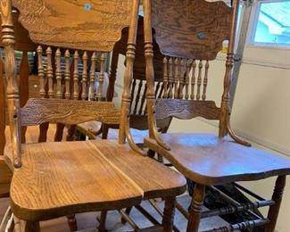 #163	project piece round oak pedistal table with 3 as is oak chairs  48 with protect glass top 	 $50.00 			
chairs of table 
