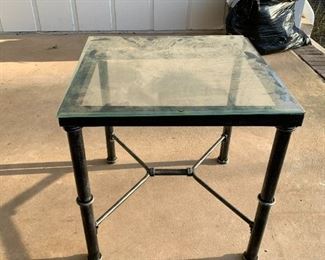 #215	outside	square black metal table with glass top 	 $20.00 			
