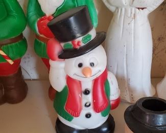 There are (2) Elf Blow molds approx 2' tall, just behind the snowman