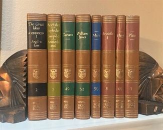 Native American bookends; leather bound books