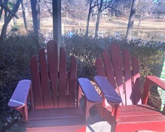 Red Adirondack chairs