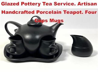 Lot 35 PETER SAENGER Black Glazed Pottery Tea Service. Artisan Handcrafted Porcelain Teapot. Four Cups Mugs